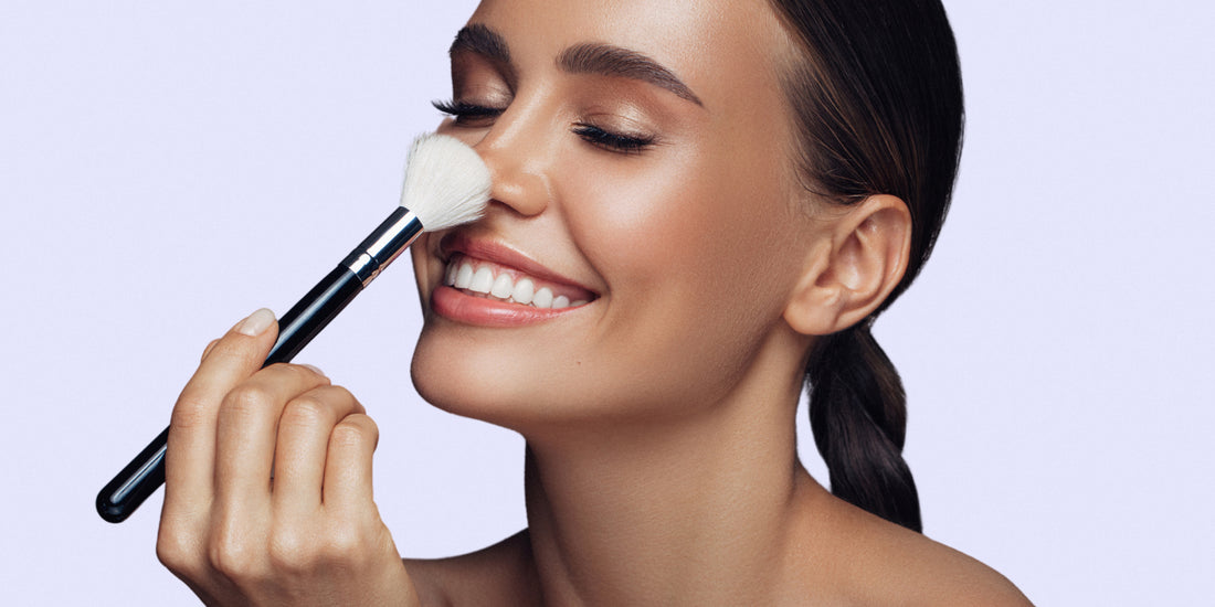 Woman applying mineral foundation with a brush. Mineral makeup is good for your skin! 